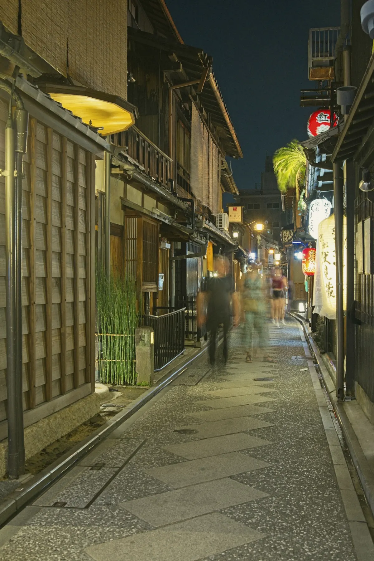 A lantern-lit lane in Kyoto at dusk